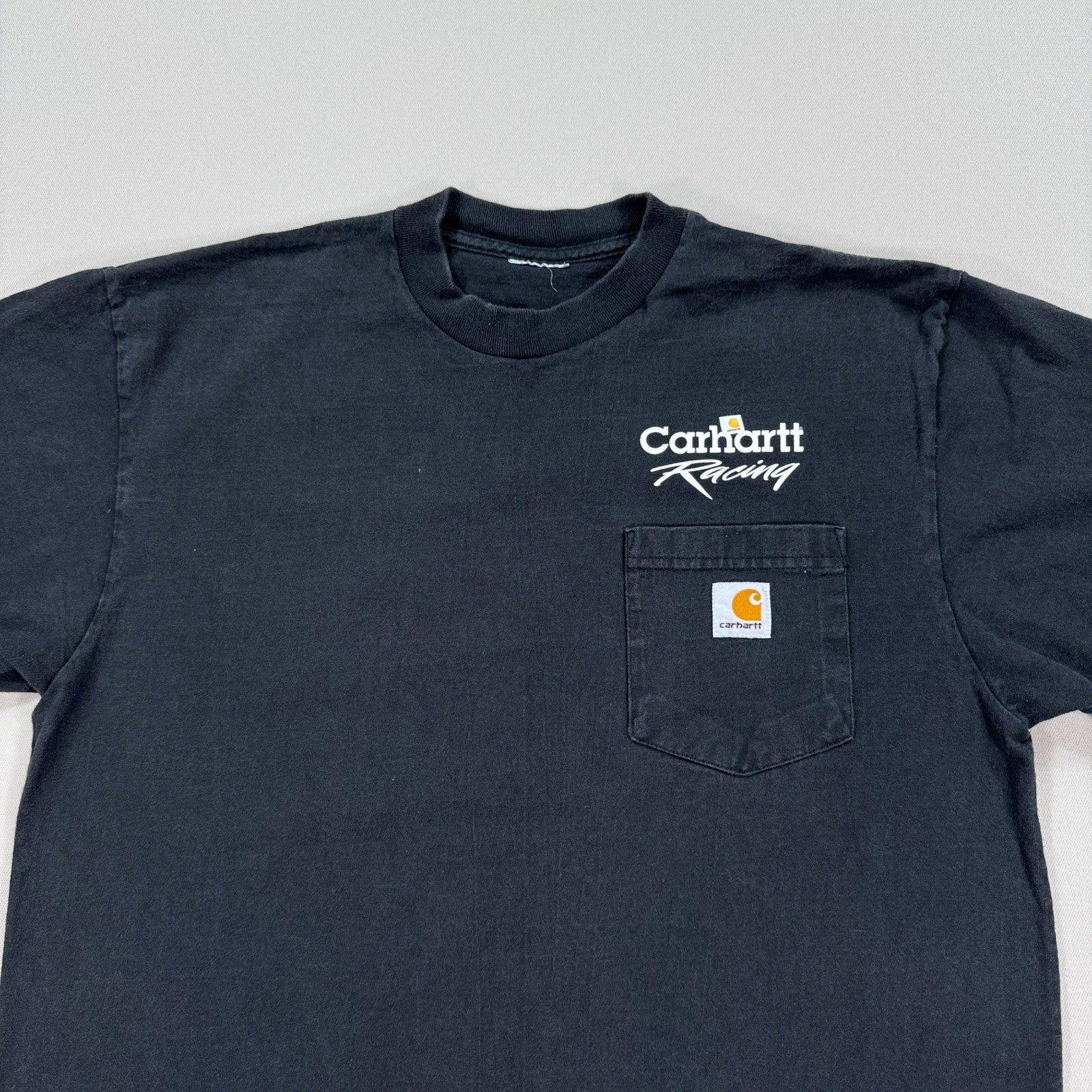 Vintage Carhartt Racing T-Shirt mens Large Faded Black Pockets Logo Crewneck